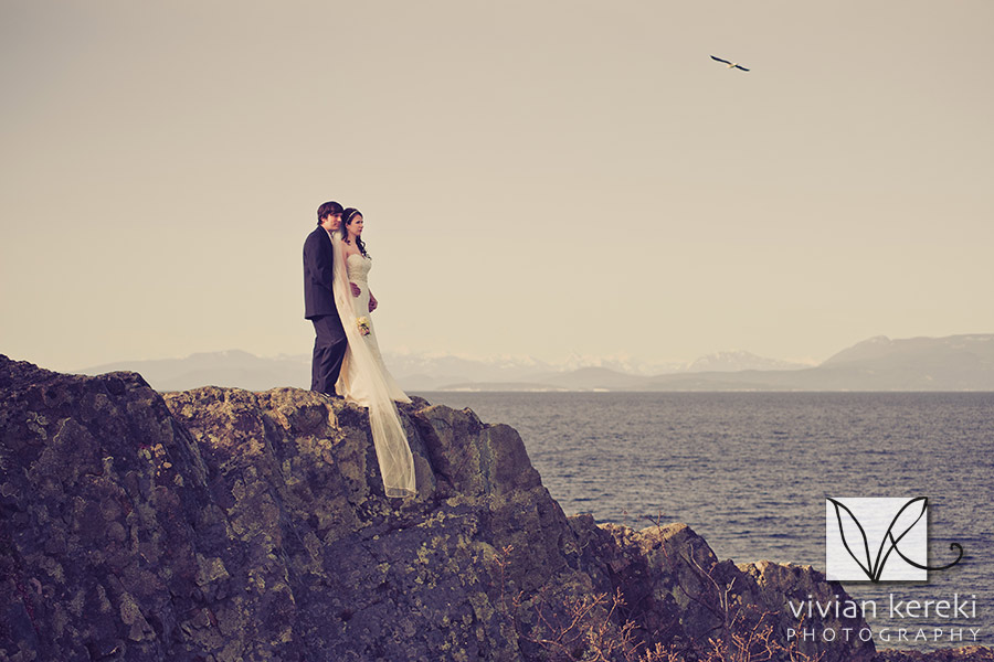bride and groom on cliff by ocean Pipers Lagoon Nanaimo